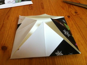 5.  Folding the points into the centre.